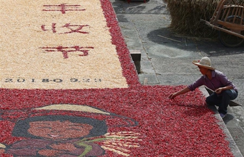 Villagers air crops at Chengkan Ancient Village in E China's Anhui