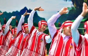 People from ASEAN countries dressed in traditioinal costumes at 15th China-ASEAN Expo